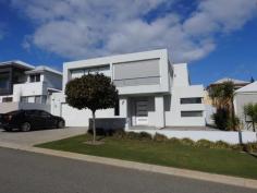  8 Patriot Link North Coogee WA 6163 $1,295,000 This sophisticated and beautiful two storey home was one of the first homes to be built in this beach lovers suburb. Built in 2011, this 4 bedroom 3 bathroom home has a generous open plan design. The kitchen, dining and living room are located upstairs with the master bedroom. Downstairs there are 3 bedrooms plus a games room that leads out onto the relaxing alfresco area. The large backyard has been landscaped to maximise the grass area creating an inviting space for children and pets to play. The elegant kitchen has generous sized polished stone bench tops with a breakfast bar, double sink, double oven, gas hot plates, glass splash-back, integrated dishwasher and plenty of cupboard space. The kitchen is the centre point of the upstairs living area between the dining and living room. The balcony is positioned next to the living room to maximise the afternoon sunset and is a enjoyable area for family and friends. The balcony also includes a built-in stainless steel BBQ and sink with alfresco blinds to provide privacy. The master bedroom is located upstairs with both a walk-in robe and built-in robe, ensuite and separate WC. Downstairs, bedroom 1 is perfect for guests or older children with a walk-in robe, ensuite with shower and WC. Bedrooms 2 and 3 have built-in robes and easy access to the ground floor main bathroom which has a shower, soaking tub and separate WC. Additional features also include a double automatic garage, ducted air conditioning throughout the home, security system, gas hot water systems and a large laundry. With the beach located only a 275 metres away, it's just a 5 minute walk and your feet are in the ocean. The Closest parklands are Perlinte Park and Omea Park, both located next to the beach. Lucretia Park and Socrates Park are only 330 metres from home next to the local shopping centre, which includes Woolworths supermarket and BWS. Port Coogee Marina is located next to the shopping centre. The bus route services are at the end of the street on Orsino Boulevard. The property is 444SQM land and is zoned R20 under the City of Cockburn local planning scheme no.3, gazetted on 20th December 2002 and updated on 29th June 2018. The property is slightly elevated from the street level and is rectangular in shape with 15.13 metres metre frontage and length of approximately 29 metres. This home a perfectly located for coastal living in North Coogee's sought after area with easy access to local shop and amenities. PROPERTY FEATURES Separate Dining Balcony Air Conditioning Built-In Wardrobes Close To Shops Close To Transport Security Alarm Garden Secure Parking Outdoor Alfresco... 