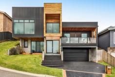  11 SAXONIA ROAD GERRINGONG NSW 2534 This custom built multi-level home boasts spectacular mountain views. The main entry features polished concrete floors which carry through to a guest bedroom including a powder room. Up on the next level is a large master bedroom with a roomy walk in robe and an ensuite with free standing bath. There is also a private deck off this room, perfect for relaxing while enjoying the stunning mountain vista. A second good sized bedroom is also located on this level. The generous kitchen featuring Ceasarstone bench tops is positioned at the rear of the home along with dining area and child friendly family room. This area opens onto a rear deck ideal for cooking on the BBQ. Another bedroom and bathroom are also located on this level along with access to a spacious entertainment room at the front of the home, providing a beautiful rural and mountain outlook. If you are requiring space along with privacy for the expanding family then be sure to inspect this beautifully appointed home! 