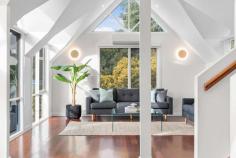  54 Seaview Road  Frankston South VIC 3199 $1,300,000 - $1,430,000 Inspired by Hamptons-style elegance and awash with natural light, this four-bedroom architect-designed residence on two thirds of an acre (approx.) offers stunning distinction and luxurious space with soaring cathedral ceilings, triangular clerestory windows, rich timber floors and lovely bay glimpses. The striking multi-level design showcases an inviting entrance hall that branches off to three different living zones including a lounge room with an open fireplace opening to the covered alfresco area and a large family room that opens to its own balcony. A contemporary showpiece that is both stylish and functional, the modernised kitchen features stone benchtops, a walk-in pantry, matte black tapware/hardware, Asko appliances and a zip tap, while designated formal and informal dining areas are equally inviting. Separately-zoned for privacy, the master suite is a haven of indulgence with a walk-in-robe and designer ensuite with double vanity, while two further bedrooms on the lower level share a family bathroom with deep freestanding soaker tub and their own lounge or home office. A charming loft provides a delightful bonus living space that can be used as a fourth bedroom or children's retreat. Standing proudly among landscaped gardens, a secure yard, CCTV, double garage and carport, this property is set within the coveted Frankston High School zone and enjoys a sought-after location just steps from Derinya Primary School and bus stops and moments from the beach and Frankston's shopping precinct. Should you require further information, please call Ash Weston on 0439 101 677 or Brooke Wegener on 0448 382 643 anytime. Please note that photo ID is required at all inspections. 