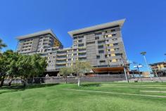  332/19 Kitchener Drive DARWIN CITY NT 0800 With two personal balconies, one overlooking the Wavepool, Lagoon and City, and the other overlooking the entire harbour, you won't have a shortage of places to sit and watch the sunsets in this top floor apartment. Situated on the top floor is this stunning and spacious 3-bedroom apartment. With a large stone benchtop kitchen, there is plenty of space to entertain. A fantastic open plan living and dining area sit adjacent to the kitchen. Large floor to ceiling glass sliding doors allow you to bring the outside in from the balconies. The apartment has been re-tiled with porcelain tiles throughout, making it cool all year round. With so many windows there are stunning flow through sea breezes all year round. The master bedroom features a stylish walk in ensuite/robe and boasts access to one of the balconies. The master bathroom features soaking tub, walk in shower, large vanity and plenty of storage. And there are 2 other good-sized double bedrooms with built in robes and split-system air-conditioning. There are 2 secure basement carparks and a lock up storage cage downstairs. Take the elevator downstairs to the award-winning restaurants, cafes, wave pool, Wharf, lagoon and shops. Only a minutes' walk into the CBD via the sky bridge, Deck Chair Cinema and lush park lands. Great investment or stunning to live in. Features: - Top floor apartment - Two private balconies - Uninterrupted views of Waterfront Precinct and Darwin Harbour - Large master bedroom with walk in ensuite and robe - Secure undercover parking - Excellent building security - Stone benchtops in spacious kitchen - Large glass sliding doors to all balconies - Fantastic location - Surrounded by great amenities... 