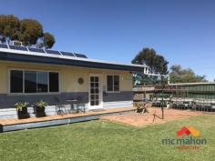  4 Coolgardie Road Southern Cross WA 6426 $219,950 A rare opportunity to buy this renovated and beautifully presented family entertainer. Settled on a large 1181sqm block with lots of upgrades and features such as swimming pool, large indoor and outdoor living entertainment areas, alfresco kitchen plus fifth bedroom/Studio at the back. Key features include: • Large lounge/ games room with air conditioning unit and entry to the outdoor alfresco • Good size country style kitchen with lots of overhead storage and stainless steel appliances • Formal dining with air conditioning • Good size bedrooms with built-in-robes • Fifth bedroom is located near the pool area that can work as a Studio • Fantastic alfresco with outdoor kitchen featuring fridge, bbq, TV and lots of storage • Large swimming pool • Large 1181 sqm corner block • Fruit trees, 8000l total capacity water tanks • 18 Solar panels Southern Cross is a mining town located on the main route between Perth and Kalgoorlie which makes it a popular stop for a transit and tourists exploring the Wheatbelt and Goldfields. The town itself offers amenities such as an airfield, a community centre, train station and sporting complex with a swimming pool. To arrange an inspection or for more information, please call today. Rates: Shire $1300 per annum (estimate, incl. ESL) Water $268.68 per annum (estimate).. 