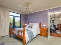  23 Wortley Road Greenmount Greenmount WA 6056 $499,000 Discover how it feels when everything is “just right”. Hidden behind an established garden and set towards the end of a cul-de-sac, this 4 bedroom, 2 bathroom, plus study brick and iron home has an aura of understated chic and oh-so-easy living. Impeccably presented indoors and out, raked ceilings with exposed beams and highlight windows deliver light, airy spaces while honey-toned timber and gold-flecked granite create an instant welcome. A decked alfresco entertaining area edged with manicured gardens and a water feature expand the functional living space and deliver a home that is family-friendly and move-in ready. 4 bed 2 bath plus study 1977-built brick & iron Open plan kitchen/meals Airy sunken lounge room Quality windows & blinds Timber floors & cabinets Easy indoor-outdoor flow 5 Kw array solar panels Impeccable 855 sqm block Close airport and Midland The sense of entering a private retreat is immediate as you make your way up the paved driveway to the welcoming front porch and stylish alfresco entertaining deck. A faultless exterior, timeless design and quality fixtures ensure this property will elicit a long, relaxing exhale and the realisation you have found a home that is “just right”. Garden views, a calming water feature and city glimpses give the covered deck an irresistible pull and lead you into the light-filled, open plan kitchen/meals and sunken lounge. High ceilings with exposed beams and German-engineered, double-glazed windows highlight the solid style credentials of this memorable property. Louvered, highlight windows add to the luminosity of the gold-flecked granite benchtops and Anigre timber cabinetry. A 5-burner hob, 900 mm oven, dishwasher and large pantry create a kitchen that is as functional as it is stylish. Tall windows fill the sunken lounge/family room with garden views and create a space that feels both cozy and spacious. A built-in bookcase and timber floors add to the sense of comfort and style, while high ceilings create a feeling of openness. The main bedroom and adjoining office are arranged at the front of the home and open to a private pergola-covered terrace. The main suite features a large built-in robe and ensuite with shower, vanity and W.C. Three good-sized junior bedrooms – one with a surprisingly large walk-in robe, two with built-ins – share a family bathroom. A walk-through laundry leads to the rear of the home where a large carport – with space for 4 cars – and a series of raised garden beds bordered by two garden sheds. Grey paving edged with a tidy lawn wraps back to the alfresco deck to expand the functional outdoor space. The spacious deck, surrounded by a low clipped hedge, offers ample space for both seating and dining. Overhead fans, an elevated position and city glimpses create a relaxed mood while direct access to the kitchen delivers seamless indoor-outdoor living. Situated within easy reach of the services and amenities of Midland, the beauty and outdoor adventures of the Perth Hills this home is a short drive from the airport and offers access to a choice of schools. Don’t hesitate, come and discover what it’s like when everything is “just right”... 