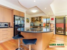  8 Challenger Place Melville WA 6156 $929,000 Stunning, picturesque, breathtaking, alluring, impressive, quality are all words that I would use to describe this gorgeous four bedroom two bathroom imposing family home. DON’T TAKE MY WORD FOR IT, COME AND SEE FOR YOURSELF! From the minute you enter, this faultless home will captivate you with its show home presentation and quality fixtures and fittings. You will not want to leave! Add to this the prime location, sought after street, walking distance to the local shops, Blend coffee shop and proximity to the schools, you now have a property that is simply hard to beat. Upon entry, you are greeted with the spacious home theatre with double french doors, which is opposite the shoppers entry to the double remote controlled garage. The laundry, separate WC/ powder room and staircase are also accessed from the front foyer. The hub of the home is at the rear of the property. Here you will find The jaw dropping gourmet kitchen, dining, family and games room. The kitchen is a chef’s delight, with an abundance of cupboards, granite bench tops, six burner gas cooking hob, dishwasher, feature lighting and a walk in pantry/scullery. The kitchen overlooks the large meals area, spacious family room, and the large double door games room, which accesses the backyard through by-folding doors. Fabulous for a family that loves to entertain. Upstairs you will find the master suite, three double sized guest bedrooms with double built in robes, a relaxation/reading nook, the guest bathroom, separate second WC, double door linen cupboard, an extra walk in linen cupboard and access to the balcony. The master suite is impressive and spacious, with views to the city, a generous ensuite and large walk in robe. The backyard is delightful and low maintenance, with an under cover entertaining area, a casual seating area opposite the spa with artificial grass, a vegetable patch at the rear and feature walls. Other amazing features of this property include city views from the front of the property, solid Tasmanian Oak floors, three WC’s, split system heating and cooling, gas bayonets, gas infinity hot water system, front balcony, alarm system, intercom, reticulation, plus much much more. Rest assured, you will not have to compromise on anything here. View by appointment or look out for the advertised home opens. 
