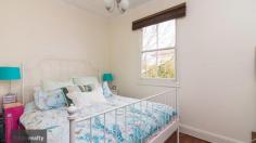  1 Ernest St, Crestwood NSW 2620 $419,000 Sitting within a picket fence, hedges and gorgeously landscaped gardens, is the quaint cottage located at 1/20 Ernest Street, Crestwood. A home full of character and charm, this home offers endless opportunity for a first home buyer, downsizer or investor. Entering the property through the lush front garden with synthetic grass and paved walkway, into the entrance of the home you’ll find the first bedroom on your right and the bathroom on the left. The bathroom has recently been completely renovated with new fittings, finishes and a gorgeous claw foot bathtub/shower combo. Through a single glass French Door, you enter the main living space with fireplace and split system. Off this space is access to the second bedroom. French Doors open up onto a decked entertaining space with hot tub. This outdoor courtyard gives access to the front and back of the home and continues the gorgeous landscaping throughout. The kitchen is located off the living space. It has recently been updated and gives a contemporary feel, while still keeping the character of the home. There is ample storage space, and a breakfast bar, making it a very functional kitchen in its design. Off the kitchen is access to the laundry room, which takes you out the back of the home. There is another private outdoor space, with a covered paved area and access to the single carport and garden shed. Although the cottage sits on a duel occupancy block, it offers privacy and space with high hedges, fences and screens. Living at 1/20 Ernest Street, Crestwood, makes you feel that you are living in your own little sanctuary. 