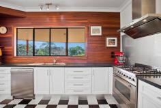  23 Callistemon Dr Federal NSW 2480 $1.25m Escape from the hustle & bustle, to one of the hinterlands highest & most peaceful positions. On 2½ acres is this timber & Colourbond home positioned high on a gently sloping block on a quiet no through road – with established foliage around the fenced boundaries. Set well back from the road with lighthouse glimpses - this masterbuilt 3 bed, 2 bath family home features timber throughout, the living room with a raked cathedral ceiling adjoins the dining area, whilst the family room & new granite & timber kitchen with Euro appliances, pantry & servery – all face the north. Currently the south wing hosts 3 bedrooms, the master with ensuite however with the potential to convert the double lock up garage easily into a 4th bedroom or granny flat – all under the one roofline. Full length wrap around verandahs to the home & adjacent to the home is an additional large double garage with benches to accommodate either cars, machinery or workshop.  Features Verandah Indoor entertainment area Outdoor entertainment area Undercover outdoor area Fireplace Water Tank... 