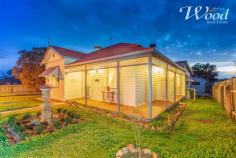  38 Ivor St Henty NSW 2658 $279,000 This home oozes character, meticulously renovated throughout to showcase a terrific example of the Federation-Californian Bungalow era. I am in love with these central hallways, Murray pine timber flooring, ornate pressed metal ceilings, spaciously extended to 10 foot. Another classic feature are the several open fireplaces throughout this magnificent home, including the master & second bedroom, then again predominantly located in the grand formal lounge room which offers ample space for a study nook or formal dining. The beautiful home comprises 3 bedrooms, 2 bathrooms, 2 living rooms and a near brand new 9m x 6m lockup garage. Set on a marvellous 1012sqm block of land, there is easy access from a side lane plus the front street with double gates to a secure yard ideal for a swimming pool installation in future or other personal requirements. There's a feeling of further space and privacy with no actual houses either side of this residence. An appealing extension has created the second family room, meals area and kitchen. Although the ceiling height is lowered only a foot in this area, you don't feel claustrophobic in the slightest in this wonderful practical home. The renovated kitchen includes a gas stove, good storage, a reverse cycle split system air conditioner and another door which leads out to the rap-around federation styled verandah's that appreciate the northerly aspect, not to mention those beautiful new Merbau timber floorboards. The main bathroom has been tastefully fully renovated, boasting a walk-in shower recess, bath, toilet and vanity. An additional shower and toilet has been installed to accommodate visitors or a larger family within the laundry configuration. A new instantaneous, efficient gas hot water service has also been installed just showing no stone was left un-turned with the current owners desire to create a brand new home feeling which didn't reflect on the contemporary architecture of today. Spoilt for choice, you can relax on the front verandah's, around the grounds or entertain undercover on a rear decked pergola. The triple lockup garage offers 2 roller doors, one remote access for car, boat or caravan storage plus room for a workshop. There is even a cute wood shed. Henty is a vibrant country town where community is actually recognised. The locals are welcoming (even to us wonderful agents) and there are several community groups, a men's shed, golf course, local schools and more. The town is a good halfway spot, where you could shop in the cities of Albury or Wagga without too much travel and still buy a home like this one, that would be an addition $100K or more in Albury's outer suburbs. 