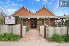  147 High St Rutherglen VIC 3685 $820,000 A classic federation style residence built in 1897 by Dr John Harris who arriving in Rutherglen in the latter part of the “gold mining era” became quite prosperous and built “Carlyle House” to act firstly as a prestigious residence for his family and secondly to as a surgery to service the medical needs of the township. Dr John Harris was a “colourful” character who at one stage entered politics and became Minister for Education in Victoria “Carlyle House” is steeped in the history of Rutherglen. “Carlyle House” changed hands several times in the ensuring one hundred years servicing as a residence, a boarding house and a day care centre until the property was purchased by John & Robin Webb in 1993 who set about refurbishing the property to the grandeur of the original property and designed parts of the original property to allow for the creation of a high profile “Bed and Breakfast” facility without detracting in any way from the ability of the property to return to a stately residence at any time. The hospitality enterprise currently in place includes two (2) modern garden rooms of one bedroom, lounge room, and ensuite facilities.  These two (2) smaller apartments continue to attract holiday and bed & breakfast usage. “Carlyle House” Allotment Area 1,020m2 - Accommodation with direct access to both High Street and Murry Street. “Carlyle House” Location Central Rutherglen only 100 metres from the township central area.  Rutherglen 300kms municipally Hume Free.  12kms to Corowa on the Murray River, 35kms to Lake Mulwala and only 40kms to the vibrant rural cities of Albury – Wodonga and Wangaratta.  A most convenient location. Rutherglen is a very popular tourist destination.  A great place to live. “Carlyle House” Main Residence A genuine federation building incorporating five (5) separate bedrooms, three (3) of which have full ensuite facilities and two (2) bedrooms are serviced by a shared bathroom.  All presented at the highest level. A two (2) bedroom upstairs apartment with two (2) way bathroom compliments the five (5) individual bedrooms within the main residence.  A long hallway provides access to all areas of the residence including a formal dining room, a sunroom meals area, a verandah meals area plus a day reading room. A full commercial kitchen with quality appliances completes this most impressive residence.  Special features include ducted heating, evaporative cooling, ceiling fans in each bedrooms, high quality fittings, quality carpets, spacious bedrooms and ducted vacuum system. “Carlyle House” Extra Accommodation Located within the garden area of the main residence with a separate entrance are two (2) individual hospitality cottages.  Each cottage provides an attractive meals living area and a well-appointed bedroom with ensuite facility, ceiling fans, built-in robes and quality fittings.  Delightful garden surrounds. “Carlyle House” Gardens & Surrounds Well-designed low maintenance established gardens and lawns add to this significant residence. “Carlyle House” Remarks “Carlyle House” provides a rare opportunity to those that may wish to establish this gracious property as a permanent residence, to continue the hospitality enterprise as has been established over the years or to partially proceed with a hospitality enterprise by use of the “garden cottages” only.  The options are there and all will become obvious on inspection. “Carlyle House” is available for sale on a “walk in – walk out” basis with all high quality furniture and fittings to pass to the purchasers on a negotiated sale. “Carlyle House” is for sale at a stated price of $820,000. Inspection by Appointment. 