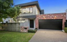  1 Beatty Parade Mornington VIC 3931 A sleek contemporary profile filters through this stunning four-year-old two-storey residence on the cusp of Main Street’s vibrant cafes, shops, entertainment and the beach. Designed by Cahill Building Group to offer quality custom-built low-maintenance surroundings, this three-bedroom, 2.5 bathroom residence combines superb dimensions with eye-catching appointments. Showcasing polished concrete flooring, double-glazed windows, reclaimed brick and shiplap walls, the interiors are edgy and exciting while offering fabulous liveability. The generous proportions are showcased with LED lighting and highlighted in the spacious north-facing open-plan living and dining domain with a gas fireplace, floating stone topped joinery and window wall with sliding doors to a private entertaining deck where you can dine amidst the scent of roses. The kitchen is state-of-the-art and combines functionality with sublime appointments including mood and task lighting, herringbone splashback, breakfast bar, Fisher & Paykel appliances including a 900mm freestanding stove and twin drawer dishwasher, integrated bins and pantry. A ground-floor main bedroom with outdoor retreat, huge fitted walk-in robe and luxurious ensuite with double shower heads complements a top-floor children’s retreat with a rumpus room, study nook, gorgeous family bathroom with freestanding bath, separate toilet and two double bedrooms each with reverse-cycle air conditioning and fitted built-in robes. Immersed in the heart of Mornington, this fabulous abode is positioned within a few minutes’ walk of Main Street’s cafes, restaurants, boutique shops and cinema as well as the beach, Mornington Primary School, buses, health services and parks. If you appreciate low maintenance living without comprising on quality, then this stylish home is for you! 