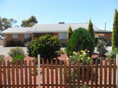  39 Yilgarn St Cunderdin WA 6407 $249,000 Immaculate Double Brick Home with Colourbond Roof, Kitchen/Dining/Lounge open living, 2 spacious Bedrooms with BIRobes, Laundry/Bathroom combined with Shower Recess WC access as well from second bedroom, Porch, back Verandah with concrete floor and rollup blinds, Electric Stove, Electric HWS, Duct Aircon, plus Split reverse Aircon, Carport, 2 Garden Sheds, Rainwater Tank, Gardens are immaculate, Fully Fenced. 