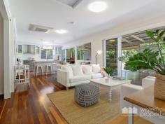  30 VICTORIA AVENUE, Woody Point |  Waterfront Properties Redcliffe Stunning renovated cottage on 1012m2 block! Nestled behind a white picket, tree-lined fence this immaculately presented property has much more to offer than meets the eye. Having undergone a top to bottom tasteful renovation in recent years this home is move-in ready and is sure to impress from the formal entry to the open plan kitchen and living areas that flow effortlessly out to a fantastic covered deck overlooking picturesque gardens. Additional features of this charismatic property include: - 3 Good size bedrooms - Master with WIR - Polished timber floors, high ceilings, VJ walls - Formal entry - Multiple formal and informal living areas - Modern, gourmet kitchen with gas cooktop, stone benchtops + good size pantry and island bench - 2 tastefully renovated bathrooms - Private front verandah - Air-conditioned main living - Spacious laundry - Side access with automated gate through to the huge man-haven, including lock-up garage + room to store the boat/trailer/caravan and anything else you may have under cover - 2nd driveway with offstreet park - Garden shed - 1012m2 of beautifully landscaped land with fresh water bore - Just over 300m to the waterfront, walking distance to Bramble Bay Bowls Club, Pelican Park and Aquasplash! - 20 min to Brisbane airport, 30 min to Brisbane CBD With far too many features to possibly list, this magnificent property is an absolute must to inspect. Call Kevin on 0418 125 356 to arrange your private inspection today! 