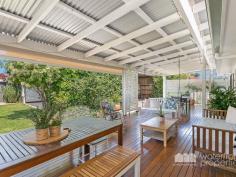  30 VICTORIA AVENUE, Woody Point |  Waterfront Properties Redcliffe Stunning renovated cottage on 1012m2 block! Nestled behind a white picket, tree-lined fence this immaculately presented property has much more to offer than meets the eye. Having undergone a top to bottom tasteful renovation in recent years this home is move-in ready and is sure to impress from the formal entry to the open plan kitchen and living areas that flow effortlessly out to a fantastic covered deck overlooking picturesque gardens. Additional features of this charismatic property include: - 3 Good size bedrooms - Master with WIR - Polished timber floors, high ceilings, VJ walls - Formal entry - Multiple formal and informal living areas - Modern, gourmet kitchen with gas cooktop, stone benchtops + good size pantry and island bench - 2 tastefully renovated bathrooms - Private front verandah - Air-conditioned main living - Spacious laundry - Side access with automated gate through to the huge man-haven, including lock-up garage + room to store the boat/trailer/caravan and anything else you may have under cover - 2nd driveway with offstreet park - Garden shed - 1012m2 of beautifully landscaped land with fresh water bore - Just over 300m to the waterfront, walking distance to Bramble Bay Bowls Club, Pelican Park and Aquasplash! - 20 min to Brisbane airport, 30 min to Brisbane CBD With far too many features to possibly list, this magnificent property is an absolute must to inspect. Call Kevin on 0418 125 356 to arrange your private inspection today! 