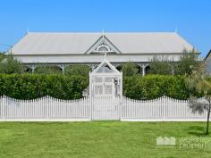  30 VICTORIA AVENUE, Woody Point |  Waterfront Properties Redcliffe Stunning renovated cottage on 1012m2 block! Nestled behind a white picket, tree-lined fence this immaculately presented property has much more to offer than meets the eye. Having undergone a top to bottom tasteful renovation in recent years this home is move-in ready and is sure to impress from the formal entry to the open plan kitchen and living areas that flow effortlessly out to a fantastic covered deck overlooking picturesque gardens. Additional features of this charismatic property include: - 3 Good size bedrooms - Master with WIR - Polished timber floors, high ceilings, VJ walls - Formal entry - Multiple formal and informal living areas - Modern, gourmet kitchen with gas cooktop, stone benchtops + good size pantry and island bench - 2 tastefully renovated bathrooms - Private front verandah - Air-conditioned main living - Spacious laundry - Side access with automated gate through to the huge man-haven, including lock-up garage + room to store the boat/trailer/caravan and anything else you may have under cover - 2nd driveway with offstreet park - Garden shed - 1012m2 of beautifully landscaped land with fresh water bore - Just over 300m to the waterfront, walking distance to Bramble Bay Bowls Club, Pelican Park and Aquasplash! - 20 min to Brisbane airport, 30 min to Brisbane CBD With far too many features to possibly list, this magnificent property is an absolute must to inspect. Call Kevin on 0418 125 356 to arrange your private inspection today! 