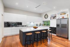  129 Webster Street Lake Wendouree VIC 3350 $2,600,000 - $2,700,000 Set amongst idyllic green gardens and mature trees on a private 1300sqm block is this enchanting period home, only metres from Lake Wendouree. One of Ballarat's most coveted locations, Webster Street is a tree-lined avenue of heritage homes and historic charm. The house was designed and built by Architect Wilfred Coltman in 1928 and retains the superb period features of the era combined with the conveniences of modern living. The original areas of the home feature wood panelling and coffered ceilings, along with solid wood doors set with leadlight glass panels. A formal entrance welcomes you, rich with the tones of dark wood and warmed by polished timber flooring. The formal living at the front of the home is full of period character, overlooking the lush gardens through the big bay window. Sliding doors lead to the huge master bedroom, with its lovely deep sills and open fireplace. The adjoining bathroom is large and beautiful, blending modern tiling and glass shower with old world features such as the clawfoot bath and fireplace. There is also a separate and spacious walk-in robe, completing the master suite. Three other bedrooms also enjoy the elegant features of the period, the largest offering coffered ceilings and a beautiful open fireplace.. Each bedroom has walk-in robes while one also has its own ensuite, which would be ideal as guest accommodation. A fifth bedroom has built-in shelves making it ideal as a possible study. A modern extension at the rear of the home houses the informal living areas. The kitchen is large and modern with new AEG appliances including induction hot plate and dual ovens, a built-in wine rack, large walk-in pantry, electrically operated overhead cupboards and drawers, marble benches and an island bench. There's even room for a double sized fridge. Reverse cycle air conditioning maintains perfect temperature control. The kitchen forms part of an open plan family area with modern dining and living spaces. A wall of windows in the family area offers garden views and glass doors lead out to the huge terrace and outdoor entertaining space with an automatic self-closing, fully adjustable louvred roof. The family living room has windows on three sides, with floor-to-ceiling height windows framing the open stone fireplace and solid cement hearth. Two sets of bi-fold windows can be opened to let the outside room become part of the living space. This is luxury and comfort combined. Throughout the older section of the home are a host of original features including high ceilings, picture rails, wooden mantlepieces, wood panelling, leadlight windows and deep windowsills. Superb light fittings add to the feeling of style and elegance. The modern wing is streamlined and beautiful, making the most of modern touches like downlights and a wine storage room. The home has hydronic heating and a ducted vacuum system throughout. Outside, a three-car garage with remote control door, and connected to water and power, mature trees and a 25,000-litre water storage tank with pressure pump complete the picture. A remote-control front gate and remote sensor lights along the driveway mean you don't have to lift a finger until you're safely parked. This is a distinguished home and a welcoming one. Properties in this area are highly sought after and this property is now offered for sale for only the third time in its life. This is a premier piece of heritage real estate in an ideal location, just a short walk from Lake Wendouree, cafes, hospitals and the finest schools. This is one of Ballarat's finest homes and it could be yours. To arrange a private inspection of this grand old home, contact Tony Douglass on 0418 555 973 today. 