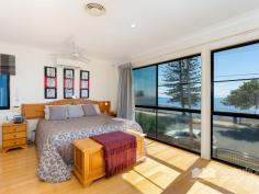  5 KENNEDY ESPLANADE, Scarborough |  Waterfront Properties Redcliffe Rare opportunity - North facing beachfront home! This rare opportunity to own this North facing beachfront home with amazing views across the bay is one not to be missed. On a 675m2 block this large rendered brick home has a great open plan design to maximise the spectacular views. Some of the features of this stunning home include: - North facing on 675m2 block - Beachfront with amazing views - Open plan living/kitchen/dining - 4 Generous size built-in bedrooms (4th bed has 2 way bathroom) - Huge master suite with WIR and ensuite - Ducted air-conditioning throughout - Security system - Side access ideal for boats & caravan - Triple garage Positioned right on the beach and only a minutes walk to Scarborough Shopping Village this impressive property boast many more features, too many to list! Call Kevin on 0418 125 356 today to arrange a private inspection! 