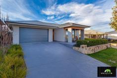  29 BAXTER LOOP GOOGONG NSW 2620 $790,000 - $830,000 White Rhino Property is proud to present 29 Baxter Loop to the market. This immaculate property presents the perfect opportunity to secure your piece of paradise in thriving Googong As you enter the home you will be wowed by the number of eye catching inclusions. This impeccably presented house is only 3 years old, and is the perfect example of "Turn the Key and move in." Flawless in design with impressive inclusions throughout including polished concrete floors, magnificent water feature and deck, intimate enclosed alfresco area, ceiling fans in all rooms and so much more. The thoughtfully designed floorplan caters for relaxed family lifestyle and living. This split level house offers generous open-plan living areas, and is the perfect home for the avid entertainer. A wood fireplace in the formal lounge provides ambience and warmth, an ideal place for family and friends to relax and enjoy each other's company. The family room / living area overlooks the undercover alfresco area & backyard, offering an alternate space for relaxing or entertaining. A functional modern kitchen is sure to be the hub of the home with gas cooking, stone bench tops, large breakfast bar and walk in pantry. The main bedroom is situated at the front of the house, and presents as the perfect parents' retreat, complete with a modern ensuite and beautiful walk-in wardrobe. The remaining three bedrooms are generous in size and all have built-in wardrobes. This beautiful home has all it all, you'll be living in one of the most prestigious neighbourhoods, so look no further!!! Features: - Spacious master with walk-in robe and ensuite - Ensuite with his and hers vanities - Polished concrete flooring - Wood fire & water feature - Large open family room - Theatre room / library - Kitchen with stone bench tops - Electric oven & gas cooktop - Breakfast bar island & walk in pantry - Stainless steel appliances - Covered Alfresco area - Ceiling fans in all rooms - Internal laundry - Ducted zoned heating and cooling - Double lock up garage with internal access - Landscaped gardens - Water tank... 