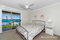  2 Opal Close Swansea Heads NSW 2281 $1,790,000-$1,969,000 If this isn't paradise, we know where they got their ideas from. Nestled between pristine Swansea Channel and one of the prettiest coastlines NSW has to offer, this home is literally 100m from swimming & fishing, or 500m from sensational surf at Hams Beach. Step inside to the cool elegance of coastal living and enjoy a lifestyle envied by all. The lower level has a modern, self contained guest suite, complete with kitchen, laundry and living spaces. Enjoy stunning views from the deck, living area and bedroom or wander to the pool and have a refreshing dip while admiring the view. The main residence features 180 degree panoramic views framed by floor to ceiling glass windows and doors from the open plan living area. You will not miss any of the action on Swansea Channel, or look across the channel to 9 Mile beach to check the surf! Beautiful by day and by night, watch the lights twinkle across the water from nearby Swansea. Entertaining is a breeze in this stunning home, with the chic kitchen right in the centre of the action. Timeless white cabinets and stone bench tops. A big island bench with breakfast bar will keep the chef involved in the party. Although there'll never be a shortage of willing guests, this home is perfect for quiet evenings and family get togethers. There are three bedrooms on this level, all with built-ins, ceiling fans & ducted air. Two of the bedrooms enjoy stunning views through sliding glass doors ... step out onto the balcony ... what a way to start your day! The Master suite features a gorgeous ensuite and big walk-in robe as well as a huge built-in wardrobe. Living is easy here! Swansea Heads peninsular only has around 500 homes, yet just 2.5km away sits the Caves Beach Resort, with restaurant and entertainment. Swansea CBD shopping is just a 5 min drive away ... that's if you don't want to go by boat or SUP! The home handy person will enjoy a separate, massive workshed with bench. There's also a huge under house storage area for push bikes, SUPs and Kayaks. The single garage is ideal for Jetski's, motorbike or smaller boats and the double garage will house whatever else you have! There are 16 solar panels fitted, along with ducted vacuum and an auto sprinkler system for lawns & gardens. Imagine family gatherings around the pool, or watching the sky change colour at the end of the day from your balcony overlooking the cool aqua waters of Swansea Channel. Yes! Living is easy here! Take the tour of this stunning home to see all that it has to offer! KEY FEATURES: Air Conditioning Built-In Wardrobes Garden Secure Parking... 