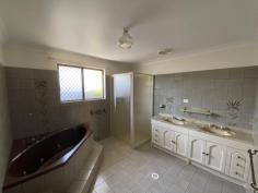  5 Lulba Court Braitling NT 0870 This spacious Braitling home is a renovators dream! This property will be offered by way of auction to be conducted on 25th January at 10:00am. With 5 bedrooms and two bathrooms, there is plenty of room to explore and personalise! The front of the house is open and welcoming with two separate driveways, garden beds and a side gate to access the back of the property. The kitchen offers a huge amount of both cupboard and bench space, separate pantry and serving counter. The dining room sits separate from the kitchen with features including downlights and access to the side passageway through large glass doors. The spacious, sunken living room offers two arched-brick entry ways, pendant lights and so much room to entertain. The master bedroom boasts carpeted floors, a separate study, built in robe AND walk in robe and ensuite. The other rooms are all generous in size and all offer different features including BIR's and even sliding door access to the front of the property. The main bathroom is spacious and boasts a large bath, shower and a double vanity with ample storage space. The outdoor area offers so much potential to truly personalise and make the space your own. Featuring a spacious yard, large in-ground pool, BBQ area, garden shed and undercover entertainment area. This space is perfect for any size family and will be the main attraction. 