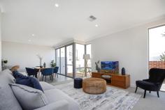  5 Basanite Loop TREEBY WA 6164 $449,000 This stunning brand-new 3 bedroom 2 bathroom two storey home offers quality low-maintenance living and entertaining and is superbly situated on a fantastic Green Title corner block within the wonderful “Calleya Estate” close to future playing fields and within easy walking distance of the proposed town centre where childcare facilities are now available and a café is set to open later this year. Externally, a striking modern façade is complimented with feature brickwork which all blends perfectly internally with a light, bright and open-plan living and dining area, overlooked by an impeccably-appointed kitchen with sparkling stone bench tops and Ilve appliances. While the living space extends out to a pleasant north-facing entertaining alfresco, the dining zone seamlessly flows on to a second paved courtyard – complete with power points and a gas connection for barbecues, just in case some extra unexpected guests pop by. Upstairs, the sleeping quarters are headlined by a large master-bedroom suite where a “his and hers” mirrored built-in wardrobe space meets an intimate front Juliet balcony to watch magical sunsets from, as well as a spacious ensuite bathroom with a huge shower, a toilet and a sleek stone vanity. There are also off-road parking bays for visitors opposite your secure remote-controlled double garage. The estate plays host to a plethora of local parklands whilst also enjoying a very handy proximity to the new Cockburn Aquatic & Recreation Centre (ARC), a junior BMX track, outstanding family playgrounds, a dog adventure playground, barbecue facilities, Atwell Primary School, Cockburn Gateway Shopping Centre, Cockburn Central Train Station, the freeway and a whole lot more. For a residence you will love, look no further! WHAT’S INSIDE: • 3 bedrooms, 2 bathrooms • Light-filled open-plan living and dining areas with access out to their respective front courtyards • Tiled kitchen with stone tops, double sinks, tiled splashbacks, a double pantry, dishwasher and quality Ilve gas-cooktop/oven • Concertina doors reveal a cleverly-concealed European-style laundry downstairs, complete with access to the powder room, plus ample hallway storage in the form of a large four-door linen cupboard opposite • Upstairs bedrooms, including a carpeted north-facing 2nd bedroom with mirrored built-in robes and splendid views to Perth’s rolling hills • Carpeted 3rd bedroom with mirrored BIR’s of its own • Main upper-level bathroom with a shower, separate bathtub, a stone vanity and toilet WHAT’S OUTSIDE: • Remote-controlled double garage with internal shopper’s entry, an under-cover clothesline and access to a rear courtyard that is ideal for bin storage • Alfresco and sitting courtyards off the main open-plan space downstairs • Easy-care reticulated gardens • Off-road parking bays opposite the home EXTRAS: • High ceilings throughout (including to garage) • Quality carpet throughout • Ducted and zoned reverse-cycle air-conditioning • Feature down lighting • Feature skirting boards • Instantaneous Rinnai gas hot-water system • Designed by award-winning architect Hames Sharley • Built by quality W.A. builder Dale Alcock Projects • Green Title corner block • No strata fees to pay LOCATION: • 25-minute drive from Perth CBD • Close to the freeway, shopping and public transport at Cockburn Central (just four stops to the city) • Walk to a plethora of local parklands with playgrounds.. 