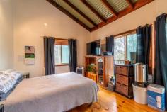  49 Blaxlands Arm Road Laguna NSW 2325 $420,000 to $440,000 – A secluded timber cottage awaits the new owner in the picturesque Wollombi Valley – Rare 5 acre lot in a natural bush land setting, set into the hill with views through the trees towards the surrounding mountains – Inside, cathedral like ceilings adorn the whole of the internal cottage creating a wonderful ambiance – The timber kitchen is open planned and looks out over the living and dining space, timber flooring throughout add to the feel of the cottage – A brand new split system A/C and combustion fireplace make this a comfortable home all year round – The two bedrooms are to one end of the cottage and are quite sizeable, with bush views – The bathroom is combined with the laundry and has a claw foot bath and corrugated iron feature walls – Opening from the living room is the large timber deck overlooking the duck pond, the perfect place to relax, enjoy a BBQ and entertain – Tank water is supplied by an approx 20,000 litre tank and a garden shed for storage complete the package – Mains power, very rare in this location! – A new lifestyle awaits, or the perfect opportunity for a weekender to escape the city life. Call to arrange your inspection today!.. 