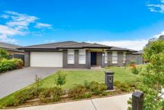  31 Grantham Cres Denham Court NSW 2565 $779,000 This 3 year old New Living Home will have impressed you the moment you step inside. Situated in a quiet location with a beautiful bush outlook and view, the home is perfectly presented inside and out and offers light filled interiors plus a modern inclusions list. Willowdale's riparian corridor is at your front door (walkway through the bush that links all parts of Willowdale off-road). Boasting plenty of privacy with no neighbouring homes opposite and approx 1.3km to Willowdale Shopping Centre. The home features: * Four bedrooms with built ins to all * Walk in robe and ensuite to master bedroom * Open plan lounge, dining and kitchen areas * Modern kitchen with dishwasher, gas cooking and stainless steel appliances * Large main bathroom with floating vanity * Extra features include ducted air conditioning, ceiling fans, plantation shutters and downlights throughout * Tiled alfresco area * Low maintenance grassed yard * Double lock up garage as well as plenty of off street parking * Situated on a 443sqm block of land approx 1.3km to Willowdale Shopping Centre * 10 minute drive to new western Sydney airport, due to open in 2026... 