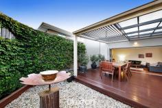  34 Teddington Road Hampton VIC 3188 $1,500,000-$1,520,000 Up-size your Bayside lifestyle in entertaining style. Scaled up with expansive proportions and entertaining spaces, this three bedroom, 2.5 bathroom streetfront home unfolds with two free-flowing living areas (each with their own gas-fire) wrapping a carefree courtyard, and a huge balconied treetop lounge - easily re-configured to sacrifice a little space and provide a fourth bedroom. Offering the great ground-floor master-suite that down-sizers and growing families want, and the pergola-covered bi-fold-wrapped al fresco area that entertainers love, this up-scale home is big on extras too; with stone-benchtops (everywhere from the prestige Blanco appliance kitchen, to the large laundry), floor-to-ceiling tiling (for private ensuite and big main bathroom) and designer detail including hard-wearing bamboo floors, privacy-enhancing e-screen and block-out blinds, and a sleek freestanding bath. Centrally heated with reverse-cycle air-conditioning where it counts and ducted vacuum throughout, the home is secured by alarm, video-intercom and 4-camera CCTV and made extra energy-efficient by 3.5KW solar panels and 5000L underground water storage. Even the car accommodation is up-sized with a double auto-garage plus parking on an exposed aggregate drive! A minute to Hampton’s latte strip and station with Haileybury and St Leonards within a walk, all the other schools in reach and the bay within a jog, this up-scale entertainer will up-size your lifestyle. 
