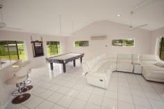 141 Telecom Road Bellenden Ker QLD 4871 50 km south of Cairns at the base of Queensland's second largest mountain, the Bellenden Ker range. Set on 13.86 hectares and nestled within picturesque farmland, you'll find this gracious 6 bedroom, 4 bathroom, double story solid block home, offering everything a modern home should. There's a double lock-up garage, security screens and split air conditioning. The very spacious master bedroom includes an ensuite bathroom with tiled floor to ceiling, a spa, separate shower, double vanity and walk in robe. There are 2 more downstairs bedrooms, one with ensuite, both with built-in robes, a large semi open dining and lounge plus the modern kitchen with granite benchtop and stainless steel appliances. In the north wing and taking up this whole side, is the massive entertaining area with included billiard table and bar. As you continue up the grand staircase, this leads you through to a spacious landing before continuing onto another 3 bedrooms and bathroom. There is then a full-length patio overlooking the rear entertaining area, with views of the in-ground swimming pool. The horse walking carousel can be seen to the right. You don't have to worry about bringing dirt into the house as there is an outside bathroom backing onto the garage. Walking around the property, you will find 20 fully enclosed paddocks coved in specialised humidicola grazing grasses, most with their own individual shelters. Numerous well-established fruit trees, plus an open plan workshop connect to multiple livestock holding pens. The owners will even include with the sale their tractor with bucket, backhoe and slasher attachments. You may be even lucky to catch a glance of the local platypus playing in the creek situated on the property boundary. This creek has crystal clear fresh water running through it all year round, and the current owner holds a permit to draw from it. If this isn't enough, the boat ramp on the Russel River is only over the highway. This river gives access to one of the natural 7 wonders of the world, the Great Barrier Reef. This home really does have it all, don't let your dream pass you by. For a viewing book an appointment today. 
