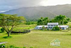  141 Telecom Road Bellenden Ker QLD 4871 50 km south of Cairns at the base of Queensland's second largest mountain, the Bellenden Ker range. Set on 13.86 hectares and nestled within picturesque farmland, you'll find this gracious 6 bedroom, 4 bathroom, double story solid block home, offering everything a modern home should. There's a double lock-up garage, security screens and split air conditioning. The very spacious master bedroom includes an ensuite bathroom with tiled floor to ceiling, a spa, separate shower, double vanity and walk in robe. There are 2 more downstairs bedrooms, one with ensuite, both with built-in robes, a large semi open dining and lounge plus the modern kitchen with granite benchtop and stainless steel appliances. In the north wing and taking up this whole side, is the massive entertaining area with included billiard table and bar. As you continue up the grand staircase, this leads you through to a spacious landing before continuing onto another 3 bedrooms and bathroom. There is then a full-length patio overlooking the rear entertaining area, with views of the in-ground swimming pool. The horse walking carousel can be seen to the right. You don't have to worry about bringing dirt into the house as there is an outside bathroom backing onto the garage. Walking around the property, you will find 20 fully enclosed paddocks coved in specialised humidicola grazing grasses, most with their own individual shelters. Numerous well-established fruit trees, plus an open plan workshop connect to multiple livestock holding pens. The owners will even include with the sale their tractor with bucket, backhoe and slasher attachments. You may be even lucky to catch a glance of the local platypus playing in the creek situated on the property boundary. This creek has crystal clear fresh water running through it all year round, and the current owner holds a permit to draw from it. If this isn't enough, the boat ramp on the Russel River is only over the highway. This river gives access to one of the natural 7 wonders of the world, the Great Barrier Reef. This home really does have it all, don't let your dream pass you by. For a viewing book an appointment today. 