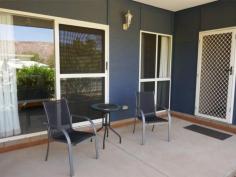  6/24 Bokhara Street LARAPINTA NT 0875 $385,000 Architecturally designed and built, this 2-bedroom, 2-bathroom, 2 car park unit, is perfectly positioned in a six-unit complex, and is unparalleled for quality, workmanship, and design. In addition to this, aspects such as privacy, security, views, close proximity to shops, schools transport, and sporting facilities, and you have the complete package. Luxury features include: —- An entrance hall that invites you inside to the spaciousness that awaits you. Large open space living area with cathedral ceilings and lots of natural light. 2 large bedrooms; the main with a walk-in robe and en suite bathroom. The second bedroom has floor to ceiling robes and is across the passageway from a fully equipped bathroom and separate toilet. Designer kitchen with gas cooking and quality appliances, adjacent to the living/dining areas, allowing the opportunity to enjoy the company of family and friends, whilst cooking up a stormgreat for entertaining. Well-appointed laundry with lots of room. Gas cooking, fully ducted air conditioning throughout, with additional split system reverse cycle cooling and heating to living area, ceiling fans and down lights, with quality blinds, curtains, and flooring, throughout. Landscaped rear courtyard area to sit, relax, and enjoy the aspect of the nearby mountain range. This is truly the one with the lot.. 
