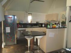  17 Hollis Street Tennant Creek NT 0860 $350,000 As you drive up to the property you will see the electric gate for added security. This 2 story home offers great views from the balcony and is set on 830m2. The kitchen has all modern appliances and plenty of cupboard and counter space with a walk in pantry, slate floors, split system a/c and fans. There are 2 bedrooms on this floor with split system a/c, fans and built in wardrobes. Going up the spiral staircase you will find the master bedroom with its own bathroom. There is plenty of cupboard and wardrobe space as well as the great view from the balcony. Outside is a huge undercover entertaining area and yard with a garden shed, rainwater tanks and another toilet. The property is currently tenanted bringing in $450.00 per week. 
