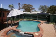  18 Johannsen Street GILLEN NT 0870 $550,000 This is a unique opportunity to acquire a lovely 3 bedroom home with an inground swimming pool and spa, together with an attached, but completely separated, fully furnished, studio apartment consisting of 1 bedroom, with kitchen/bathroom/lounge/dining area, with its own separate parking and entrance, or simply convert to create, at a very minor cost, a 4 bedroom/2 bathroom residence with an inground pool and spa, with plenty of parking, situated on 786 square metres of land. If you are an investor, please note the two areas were currently separately leased, producing an outstanding income return of $870.00 per week. If you are an owner occupier, live in the main house and rent out the studio apartment for $320 pw. Close to all facilities, this unique offering has many features, including: House -3 bedrooms with built ins -Large kitchen with plenty of storage space -1 bathroom with shower and bath -Separate toilet -Outside laundry with extra toilet -Carpet to the 3 bedrooms -Tiled living areas -Reverse cycle units and ceiling fans in every room. -Inground saltwater pool and spa, set in a paved area, and fully fenced for safety and security. -Undercover rear entertaining area overlooking the pool -Garden shed. -Double carport. -Easy care lawn and garden area. Studio apartment. -Queen size bed -Reverse cycle air conditioning -Electric stove/oven -Bathroom and toilet. -Washing machine -Fridge and freezer -Lounge and dining table. -Garden shed -Easy care garden. -Own outdoor entertaining area. 