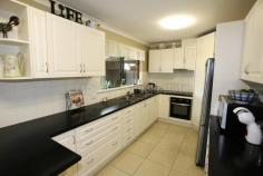  71 Goldfields Road Castletown WA 6450  $335,000 This pleasant 4 bedroom, 2 bathroom brick and tile home conveniently located near a shopping centre, service station, big park across the road and the beach is just a short stroll away. Black/White kitchen, dining & family areas, lounge and ceiling fans. Massive enclosed patio with carport and 6m x 9m powered garage/workshop. 