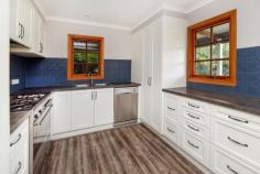  27-31 Main Street Eungai Creek NSW 2441 $489,000 - $519,000 Are you looking for a country lifestyle where you can live in a fully renovated 4 bedroom home with private living and relaxing rural outlook, yet still within easy travelling distance to shops, schools, beaches, hospitals & services etc. Then put this property on your short list. The light filled living area is open plan, leading to a huge 56m2 timber deck, great for entertaining. You have family dining incorporating a slow combustion wood heater to comfort you during those cold days and nights. The kitchen would be any chef’s delight with good bench space, five burner gas cooktop and electric oven. Plenty of drawers and cupboards for storing the essentials. Breakfast bar plus large fridge space and of course the necessary pantry. The lower level master bedroom has a walk through dressing room and ensuite. With three bedrooms upstairs all with built-ins. Well utilized storage area under stairs. Of course there is a second bathroom. This gently undulating parcel of land of 2.06 hectares (5 acres) has, solar power (think of the $$$ savings). Fully fenced (some in need of minor repair) with 3 paddocks, suit a cow or two, horses or horticulture, with the possibility of Organic Farming. School bus service just metres away. There is ample water from 3 dams with the added bonus of an underground well. No water problems here as you also have 3 separate rainwater tanks holding approx. 35,000 litres. Plus solar hot water. Two Large sheds with the capacity to park up to 9 vehicles undercover, and approx. 30m2 games room or large workshop. So there is plenty of room for your larger toys such as plant & equipment, boat or caravan. A great place to raise your children with all the necessary services just a short drive away. Family have moved north. Could this be the one for you and your family to live the lifestyle you have been looking and waiting for?.. 