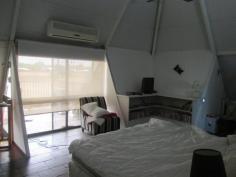  17 Hollis Street Tennant Creek NT 0860 $350,000 As you drive up to the property you will see the electric gate for added security. This 2 story home offers great views from the balcony and is set on 830m2. The kitchen has all modern appliances and plenty of cupboard and counter space with a walk in pantry, slate floors, split system a/c and fans. There are 2 bedrooms on this floor with split system a/c, fans and built in wardrobes. Going up the spiral staircase you will find the master bedroom with its own bathroom. There is plenty of cupboard and wardrobe space as well as the great view from the balcony. Outside is a huge undercover entertaining area and yard with a garden shed, rainwater tanks and another toilet. The property is currently tenanted bringing in $450.00 per week. 