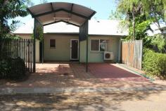  Unit 7/13 Lloyd Road Humpty Doo NT 0836 Ideal for first home buyers. Spacious fully coded 2 Bedroom 1 bathroom ground level duplex of solid concrete masonry block construction. Fully tiled and air conditioned throughout living area and main bedroom. Spacious kitchen with lots cupboard space. Bathroom renovated recently and interior townhouse fresh new paint. Built In Robes in both bedrooms. Dual parking for two cars, one under cover and other adjacent, with spare parking opposite. Solar Hot Water. Nice gardens and lock up tool shed at rear. Tiled patio verandah area at rear patio is fully concreted and tiled, ideal to relax or entertain. Rear and side courtyard is fully fenced and property has nice garden surrounds. Walk to Woolworths Supermarket, butcher and variety of shops, medical, dental and schools, all are nearby. Move in now and enjoy or rent out for $420 per week return.. 
