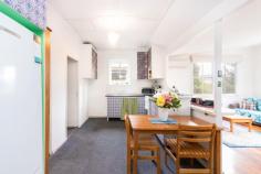  54 Schardt St Captains Flat NSW 2623  $280000 54 Schardt Street, Captains Flat is a free standing 3 bedroom, 1 bathroom cottage on 696sqm of land. A lovely and well-maintained home that may suit a first home buyer, downsizer or investor.  Enjoy your morning coffee or an evening drink on the front deck taking in the sounds of nature and views across the Valley. From the deck you enter the home to a spacious living room and instantly notice the large windows that frame outside views and plenty of light. The reverse cycle air conditioning unit in this area ensures comfort all year round. The kitchen is open plan to a meals/dining area and also includes an open pantry. In good condition the kitchen is complemented by Electric appliances. The property has 3 large bedrooms, including another reverse cycle air conditioning unit in the master bedroom. Buyers looking to possibly renovate in a highset street at an affordable price will show interest, as the bathroom would benefit from an update. If you are searching for a home with good size land, in a quiet village location and a comfortable 40 minute drive to Queanbeyan, you have the space and privacy at 54 Schardt street. FEATURES: - 2 x reverse cycle air conditioning units - Double carport under house - Electric hot water - Set on the high side of the street backing on to bushland     Please call the agent for a viewing time. In response to the COVID-19 outbreak, all Estaterealty properties can only be viewed by appointment only. .. 