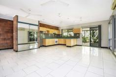  18 Trochus Crescent Woolner NT 0820 $570,000 Move straight into this modern three-bedroom, two-bathroom home that offers low-maintenance single-level living and is well presented throughout. Enjoy stress-free alfresco living on the huge covered patio in the private, leafy rear courtyard, and you'll love this excellent location that's just metres to a large park, close to schools and Parap Village Markets, and just five minutes to Darwin CBD. • 	 - Spacious open-plan living/dining area flows onto large rear patio • 	 - Huge covered patio in low-maintenance paved courtyard • 	 - Established easy-care tropical gardens create excellent privacy • 	 - Well-equipped kitchen with electric cooking and large pantry • 	 - Generous master bedroom features a large walk-in robe and ensuite • 	 - Built-in robes to good-sized second and third bedrooms • 	 - Main bathroom with shower over bath and floor-to-ceiling tiles • 	 - Split-system air conditioning throughout ensures your comfort • 	 - Low-maintenance floor tiles throughout for stress-free family living • 	 - Large double lock-up garage with laundry facilities and internal entry This well presented home is ideal for first-home buyers and young families looking for a quality low-maintenance residence with no work to do. Downsizers note the easy single-level living on offer, and investors won't need to look far to find tenants in this convenient location close to the city. Enter via the stylish integrated portico and through double front doors into the wide reception hall. The generous tiled master bedroom is privately located on your right at the front of the home and overlooks the front garden and lawn. It also features a large walk-in robe and ensuite with floor-to-ceiling tiles and a corner shower. Continue into the spacious open-plan living/dining area at rear that is also tiled and features a good-sized family kitchen with electric cooking and plenty of cupboard space. The enormous covered patio is off the main living/dining area and offers ample alfresco entertaining space without the maintenance hassles, and established easy-care tropical gardens ensure your privacy. The second and third bedrooms - both with built-in robes - join the main bathroom in a separate wing of the home off the living/dining area. There is a shower over bath plus floor-to-ceiling tiles and a separate toilet to the main bathroom that's ideal for family living. Secure parking is provided for two cars in the double lock-up garage that features laundry facilities with external side access plus a convenient shopper's entry into the home. Council Rates: $1842.09 approximately per annum Area Under Title: 443 square metres FEATURES: • 	 Built-In Wardrobes • 	 Close To Schools • 	 Close To Shops • 	 Terrace/Balcony;Air Conditioning… 