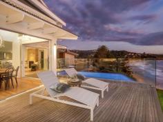  19 CALVERT PARADE NEWPORT NSW 2106 Contact agent to discuss the possibility of an inspection. Set on the oceanfront on the most exclusive street in Newport, this just completed residence redefines luxury living for the family; nestled above the beach with a sun-drenched northerly aspect, it captures the essence of relaxed sophistication and boasts a title that runs to the high watermark. This is a rare opportunity to acquire "simply the best" and enjoy one of Sydney's most coveted locations. - Designed by Dan Raymond, construction by Travers Williams - Three exquisite levels w/internal lift; endless ocean views - Open plan layout, Blackbutt floors and wainscoting throughout - Flawless interiors extend to sunlit terrace, infinity pool, bbq pavilion - Deluxe kitchen with CaesarStone island plus butlers' pantry - Indulgent master; fireplace, sitting room, designer ensuite - Total of five ensuite bedrooms plus separate built-in study - Two gas fireplaces, ducted air, workshop, charge unit for car - Full security system, laundry w/Miele appliances, guest w/c - Set in a tightly held premier oceanfront position… 