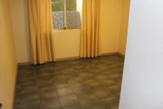  Unit 7/13 Lloyd Road Humpty Doo NT 0836 Ideal for first home buyers. Spacious fully coded 2 Bedroom 1 bathroom ground level duplex of solid concrete masonry block construction. Fully tiled and air conditioned throughout living area and main bedroom. Spacious kitchen with lots cupboard space. Bathroom renovated recently and interior townhouse fresh new paint. Built In Robes in both bedrooms. Dual parking for two cars, one under cover and other adjacent, with spare parking opposite. Solar Hot Water. Nice gardens and lock up tool shed at rear. Tiled patio verandah area at rear patio is fully concreted and tiled, ideal to relax or entertain. Rear and side courtyard is fully fenced and property has nice garden surrounds. Walk to Woolworths Supermarket, butcher and variety of shops, medical, dental and schools, all are nearby. Move in now and enjoy or rent out for $420 per week return.. 