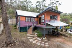  54 Schardt St Captains Flat NSW 2623  $280000 54 Schardt Street, Captains Flat is a free standing 3 bedroom, 1 bathroom cottage on 696sqm of land. A lovely and well-maintained home that may suit a first home buyer, downsizer or investor.  Enjoy your morning coffee or an evening drink on the front deck taking in the sounds of nature and views across the Valley. From the deck you enter the home to a spacious living room and instantly notice the large windows that frame outside views and plenty of light. The reverse cycle air conditioning unit in this area ensures comfort all year round. The kitchen is open plan to a meals/dining area and also includes an open pantry. In good condition the kitchen is complemented by Electric appliances. The property has 3 large bedrooms, including another reverse cycle air conditioning unit in the master bedroom. Buyers looking to possibly renovate in a highset street at an affordable price will show interest, as the bathroom would benefit from an update. If you are searching for a home with good size land, in a quiet village location and a comfortable 40 minute drive to Queanbeyan, you have the space and privacy at 54 Schardt street. FEATURES: - 2 x reverse cycle air conditioning units - Double carport under house - Electric hot water - Set on the high side of the street backing on to bushland     Please call the agent for a viewing time. In response to the COVID-19 outbreak, all Estaterealty properties can only be viewed by appointment only. .. 