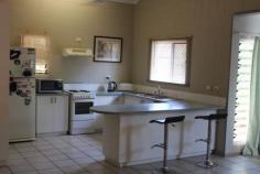 Unit 7/13 Lloyd Road Humpty Doo NT 0836 Ideal for first home buyers. Spacious fully coded 2 Bedroom 1 bathroom ground level duplex of solid concrete masonry block construction. Fully tiled and air conditioned throughout living area and main bedroom. Spacious kitchen with lots cupboard space. Bathroom renovated recently and interior townhouse fresh new paint. Built In Robes in both bedrooms. Dual parking for two cars, one under cover and other adjacent, with spare parking opposite. Solar Hot Water. Nice gardens and lock up tool shed at rear. Tiled patio verandah area at rear patio is fully concreted and tiled, ideal to relax or entertain. Rear and side courtyard is fully fenced and property has nice garden surrounds. Walk to Woolworths Supermarket, butcher and variety of shops, medical, dental and schools, all are nearby. Move in now and enjoy or rent out for $420 per week return.. 