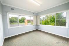  385 Dobie Street Grafton NSW 2460 Holding a highly desirable Westlawn location on approximately 600.7 square metres of level, flood-free land is 385 Dobie Street, Grafton. This property's convenient location puts you in close proximity to primary schools, the hospital, sporting facilities and the racecourse, while being just a short drive to Grafton CBD. Internally, this low-set brick and tile home offers three spacious bedrooms with carpet and blinds, a large lounge room with air conditioning and a second sitting room, study or playroom. The kitchen and dining area offer a practical kitchen and dedicated dining space. The main bathroom offers a bath, toilet and vanity with storage, while the laundry includes a shower and second toilet, also with plenty of storage. The house has been recently coated with a new paint, making it modern and fresh. The yard is low maintenance, fully fenced and offers easy living with a single lock up garage to the side. With a rental appraisal of $350 per week, this great home is perfect for investors, first home buyers and downsizers in our current market. Don't miss this great opportunity by contacting a Ray White agent today. FEATURES: • 	 Built-In Wardrobes • 	 Close To Schools • 	 Close To Shops • 	 Close To Transport • 	 Garden;Air Conditioning… 