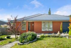  16 Orchard Avenue Huonville TAS 7109 $525,000 Nestled in beautiful rural settings with wonderful views of the surrounding apple orchards, this spacious family home is a very unique buy. Built in 2016 the home has been designed with family living at the forefront, with 2 living areas as well as an open plan kitchen and dining space. Large gatherings and entertaining will be comfortably accommodated in this home. The house is fully insulated through the walls and ceiling and combined with the double glazing and efficient reverse-cycle heat pump, heating and cooling the house is a breeze and light on the purse. There is a short 3 minute drive to the heart of Huonville offering all the shops and services one could possibly need. Only 30 minutes to Hobart's CBD with numerous transport options the property offers country-style living with all the conveniences one could want. The spacious kitchen features stone bench tops, quality appliances & a breakfast bar. The master suite is light filled and has a large walk-in robe and well appointed en suite with fully tiled shower. The remaining bedrooms all feature built in wardrobes and are serviced by a large main bathroom with separate bath, fully tiled shower and plenty of storage offered by the vanity. The backyard has been landscaped perfectly and has its own private garden with numerous fruit trees, a large chicken coop, with plenty of additional space for play, sheds or big veggie patch, offering the ability for self sufficiency in years to come. Attached to the house is a large entertainer's deck with views over the paddocks, orchards and north towards iconic Sleeping Beauty. • 	 Open Plan Living, Kitchen & Dining • 	 Fully Double Glazed and Insulated • 	 Master Suite with Walk-In Robe and En suite • 	 3 Bedrooms with Built-In Robes on other end of the house for enhanced parental privacy • 	 Potential 5th bedroom or study adjoining the deck • 	 Well Appointed Kitchen with Stone Bench Tops and Quality Appliances • 	 Bathroom with Tiled Shower and Separate Bath • 	 Large Entertainers Deck and Backyard • 	 Big SUV garage space • 	 Close to Shops, Transport and Services.. 