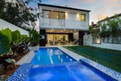  150 James St, New Farm QLD 4005 A sophisticated statement in contemporary luxury, drawing inspiration from the most forward-thinking global inner-city designs. This five-bedroom, four-bathroom architectural masterpiece delivers a cutting-edge cosmopolitan flair to Brisbane's New Farm. Garnett on James is the result of Capital Luxury Residences' desire to produce the ideal contemporary family home, one which is equal parts functional and aesthetic. Internationally influenced, reflected in bespoke cabinetry from Milan and marble from Italy and Spain, with a laser local focus on creating a 402sq m open-plan layout offering year-round comfort in Queensland's tropical climate. An inviting swimming pool and level backyard also feature prominently in a home which has been future-proofed with smart technology. Defined by its grand living spaces and pioneering design showcasing a white Afghan marble staircase, Garnett on James celebrates and welcomes the Australian family lifestyle. Garnett on James offers but is not limited to: Capital Luxury Residences + interior designer Alissa Birch + Big House Little House 405sq m block with 402sqm of living and entertaining Architectural white marble staircase, cantilever gas fireplace, feature pendants Open-plan design with multiple formal and casual living and dining areas Gas and induction kitchen w integrated premium appliances, butler's pantry Five bedrooms, each with its own ensuite featuring Afghan white marble Master with WIR, oversized ensuite with bathtub and Juliette balcony Custom timber veneer wine room with Vintec wine fridge Bespoke timber veneer cabinetry with Cinderella marble benchtops Enclosed tiled alfresco area with fully-fitted outdoor kitchen inc 5-burner bbq Family-friendly level backyard with automated sprinkler and lighting systems Swimming pool with spa and water feature Two-car accommodation, outdoor storage area for bikes etc Walk to the CBD, Howard Smith Wharves, New Farm Park, Gasworks 