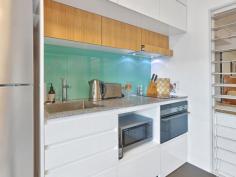  113 Commercial Rd Teneriffe QLD 4005 DESIGNER LIVING MEETS URBAN CONVENIENCE. DOUBLEONETHREE APARTMENTS. Transform your living options with this great contemporary apartment. Enjoy the buzz and vibrant urban setting in the heart of Teneriffe. Located away from street noise to the rear of the building this apartment’s interior is finished in a neutral palette with Euro inspired tap-ware and Bosch appliances to the quality flooring and custom two-pac cabinetry. Every detail has been selected for its timeless appeal. INVESTORS NOTE – Sold as is, furnished with a rental potential to $450 per week This property ticks boxes for Price, Convenience, Investment Options and Urban Style. – Large built-in bedroom with ceiling fans – Open plan living – Great galley style kitchen featuring stone bench top, glass splash backs, electric cooking – Bathroom finished in timber cabinetry with large walk-in shower – Neatly concealed seperate laundry – Large picture wide opening windows – Air conditioning – Security under building parking with internal access – Footsteps to local shopping, restaurants and the bars of Teneriffe – Body corporates $873 per quarter (net) – Council rates $394 per quarter 