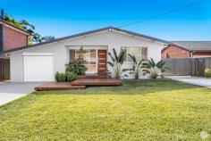  32 Wahgunyah Road Nelson Bay NSW 2315 Claiming a premier position with Dutchmans and Bagnalls Beach just minutes away, this tranquil completely renovated sanctuary is a haven to suit a selection of people. Comprising of three bedrooms over one single level with one contemporary bathroom, two lockable garages with side access for storing your caravan, boat or trailer, this residence has it all! With a sunken fire pit set amongst manicured lawns and gardens and indoor/outdoor entertaining options, this property is sure to impress. Sit around the sunken fire pit with family and friends and enjoy the quiet location or take a short stroll to Nelson Bay CBD with a selection of speciality shops and grocery store. The property evokes a spectacular sense of warmth from the moment you step inside offering contemporary design, polished timber floor boards and touches of elegant flair. Inspired from its original structure, the high angled ceilings accentuate spacious areas, with plenty of natural light sweeping throughout the home. Collaborating functionality with a seamless design, the living area transitions seamlessly via the glass sliding doors, out to the polished timber undercover deck situated amongst neighbouring treescapes. Not only does this property accommodate a seamless design, but the kitchen incorporates a servery window to ensure that entertaining is a breeze, soft close cabinetry and draws, and stainless-steel appliances. Positioned just a short walk to beautiful surrounding beaches, shops, restaurants, cafes and speciality shops, this is an opportunity not to be missed. Crafting a coastal lifestyle of absolute excellence with high quality inclusions seamlessly created for your enjoyment. Please contact Dane Queenan on 0412 351 819 or Meg Dean on 0499 912 311 to receive a complementary information package on this stunning home today! Outgoings: Council Rates - $1,637.72 approx. per annum Water Rates - $784.2 approx. per annum* (does not include water usage) Whist all care has been taken preparing this advertisement and the information contained herein has been obtained from sources we believe to be reliable, PRDnationwide does not warrant, represent or guarantee the accuracy, adequacy, or completeness of the information. PRDnationwide accepts no liability for any loss or damage (whether caused by negligence or not) resulting from reliance on this information, and potential purchasers should make their own investigations before purchasing.. 
