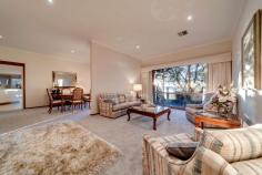  5/95 Crisp Circuit Bruce ACT 2617 Peacefully positioned in an exclusive dress-circle location backing Gossan Hill Nature Reserve and capturing magnificent panoramic views across the Belconnen Valley, Lake Ginninderra and Brindabella Mountain Ranges is this impeccably presented four bedroom family residence. Located within Bruce's most prestigious boutique complex the "Somers" is this inspirational freestanding, split level townhouse that sprawls across an expansive north-west facing block. The development was privately built by award winning builders the Rosin Bros, and with no expense spared the home showcases quality craftsmanship. The current owner has resided in this impressive home for nearly 30 years, and during this time has enjoyed its unique design, enviable location and has proudly maintained the home and grounds to the highest of standards. This architecturally designed retreat is brilliant for busy professionals or as a wonderful family home, particularly for those who love to entertain. Located on the entrance level are four spacious bedrooms, main bathroom including a luxuriously proportioned, and segregated master which boasts magnificent garden views, a bank of wardrobes along one side of the room and sparkling ensuite with spa bath and dual sinks. The fourth bedroom has been brilliantly set up as a study/home office with its quality custom built workstation. The split level design offers formal living and dining rooms which flow through to an open plan family room, meals area and impressive gourmet kitchen - the chef of the home will love the sublime cooking space. Bathed in natural light and with captivating views is the sunroom extension which is the ideal setting for year round family get-togethers or a peaceful setting where you can relax and unwind while reading the Sunday paper. The established gardens are magnificent with the Japanese influenced design displaying colours that compliment Canberra's four seasons. The gardens are designed to provide shade in the summer months, keeping the home to a cool temperature. Special features include: * tranquil and elevated position backing Gossan Hill Nature Reserve * tightly held boutique complex of seven owner occupied homes * magnificent views * freestanding split level, four bedroom townhouse * welcoming front entrance overlooking an atrium * formal open plan dining and living room with 2.7m ceilings and slow combustion fireplace * master bedroom with custom designed wardrobes * ensuite with floor to ceiling tiles, spa bath, separate shower and dual sinks * four segregated living areas * north facing sunroom extension with Sydney Blue Gum flooring, RC/AC, luxaflex blinds to all windows and external access to the timber deck and gardens * gourmet kitchen with 20mm Caesarstone bench tops, glass splashback, soft closing drawers, * Miele stainless steel pyroletic oven, induction ceramic cooktop, microwave/convection oven, dishwasher, walk in pantry, and generous storage with custom built cabinetry * open plan meals and family room with LED lighting * ducted gas heating and ducted air conditioning throughout * bedrooms two, and three are generous in size; both with built in robes * bedroom four/study - featuring quality built-in cabinetry * sparkling main bathroom plus separate toilet and powder room * as new carpet * security flyscreens to some rooms * private north facing timber deck * spacious laundry with ample storage * abundant storage throughout * spacious brick double garage with auto door * garage roof storage with loft ladder access * new steel gutter guards * 2,500 ltr water tank with pump * instant gas hot water * eight solar panels - fed back to the grid * alarm system * magnificent gardens with irrigation and rock retaining walls Living - 261.90sqm Garage - 46.40sqm Total - 308.30sqm B/C fees - $5,163.12 pa Rates - $3,164.35 pa With the top end of Bruce one of Canberra's most unique and sought after communities, you will fall in love with the unbeatable location with the rear boundary accessing hectares of natural bushland. The location is outstanding providing an easy walk through reserve to the University of Canberra and Radford College for students. On your doorstep is the AIS, three major hospitals, with the ANU and City Centre only 6 minutes away. Westfield Belconnen and the popular Jamison Plaza are close by for your convenience. ** PLEASE NOTE this property will go to auction on Thursday, 18th June at 6:00pm. To register and watch the live stream please go to www.raywhitecanberra.com.au/watch-our-auctions-live. Please call Phyllis directly to discuss further. ** FEATURES: • 	 Air Conditioning • 	 Built-In Wardrobes • 	 Close To Schools • 	 Close To Shops • 	 Close To Transport • 	 Fireplace(S).. 