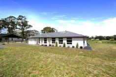  61 Greasons Rd Bundanoon NSW 2578 $699,000 DUE TO COVID-19 RESTRICTIONS ALL INSPECTIONS ARE BY APPOINTMENT ONLY Near new home with a rural feel An immaculate near new residence with all the modern conveniences and a rural feel awaits your finishing touches to the grounds and garden. Expansive views over large open paddocks with the odd cow or two. This smart and modern dwelling with its natural tones and quality finishes is ready to furnish and start living your Highlands life. Centrally located kitchen with Caesar Stone benches and well appointed appliances Family room and dining flow to the undercover outdoor terrace overlooking the acreage beyond Off the generous entry hall is the formal lounge or media room with upgraded media package installed The bedrooms are all generous in size with double robes, the master suite having a larger than normal walk-in, generous ensuite and bathed in sunshine Ducted reverse cycle a/c, fully insulated + internal access from the double garage Town water, power and telephone available with a good sized water tank + envirocycle for grey water and waste Down a quiet country lane and surrounded by rural acreage and quality dwellings on other 1 acre lots this pretty rendered home offers a view from every window and a level sun filled parcel of land. The post and rail fencing ensures a fully fenced block perfect for veggie gardens, cottage gardens and a pony or two. View by inspection or advertised open homes… 