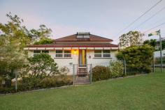  11 Birdwood Street North Ipswich QLD 4305 $299,000+ This home has been meticulously maintained, featuring high ceilings, plenty of living area, a huge amount of storage space and stunning gardens. Whether you are a first home buyer, renovator or investor - this property is truly something special; don't miss out, book your inspection today! - Massive main lounge room; air-conditioned with ceiling fan, carpet and extra-high ceilings - Huge kitchen with high ceilings and an enormous amount of preparation and storage space; ceiling fan, vinyl flooring and electric oven, large enough to serve as an eat-in kitchen if desired - Spacious formal dining/secondary living area; carpeted with raked ceiling - 3 bedrooms, 2 with ceiling fans, extra-high ceilings and additional dressing room/office spaces adjacent - Bathroom is neat and tidy and features a combined bath/shower with sliding glass screen; separate toilet - Front entry provides an additional living/office/play space; carpeted - Underneath the home is a vast concreted and enclosed storage/rumpus space with multiple sections; extremely neat and tidy with good lighting and ventilation, laundry located within the main area - Extra-wide double lockup garage with direct internal access both upstairs and downstairs - Built-in BBQ area adjacent to fully concreted driveway - Gorgeous landscaped gardens throughout the property; well established and maintained - 2 well-sized garden sheds plus greenhouse/aviary - Fully fenced property - Security screens throughout Area Details: • 	 Walking distance to public transport access • 	 2 minutes* to Ipswich North State School • 	 2 minutes* to St. Josephs Primary School • 	 4 minutes* to Riverlink Shopping Centre and Ipswich CBD • 	 6 minutes* to Ipswich Hospital • 	 8 minutes* to USQ Ipswich Campus • 	 Easy highway access for commuters.. 