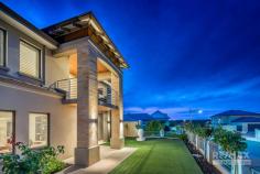  19 Tulum Approach Iluka WA 6028 Offers close 5pm 25 June 2020, the owner reserves the right to accept an offer prior to this date. Price guide in the MID 1.2mil range. Presenting the perfect blend of sophisticated design and coastal ambience. This remarkably spacious family home delivers in every aspect, including a variety of entertaining zones and open plan living that optimises natural light at every opportunity. This exquisite family home is designed to provide both sophisticated and informal retreats that facilitate contemporary coastal living. Offering an oasis of space with free flowing and relaxing modern living areas that blend effortlessly with the entertaining, dining and alfresco zones. With clever design, a functional living plan and remarkable space for the entire family, this home will exceed all of your expectations. Located in the prestigious coastal suburb of Iluka, you will discover a host of key amenities within minutes of home. Call us today for further details or plan to view this fabulous property at our next opening. Features: GROUND FLOOR • Kitchen with QStone waterfall bench-top, Blanco 900mm under bench oven, gas cook- top, Blanco range-hood, Meile dishwasher, Panasonic integrated microwave and breakfast bar • Banquet sized dining area with an alfresco outlook • Enormous central family room with feature recess ceilings & pool views • Study with built in desks, shelving and cabinetry • Home theatre with feature coffered ceilings and mood lighting • Bedrooms 2 and 3 are Queen sized with built in robes • Bedroom 4 is King sized with built in robes and Semi ensuite second bathroom • Separate powder room • Laundry with plenty of storage • Large double garage and storeroom with shoppers entrance • Mature manicured gardens with automatic reticulation • 8-metre long concrete pool with built in seating with provision for both solar and gas heating • Synthetic lawn area • Alfresco is accessed through stacked bi-fold glass doors with coffered cedar lined ceilings, ceiling fan and Jet Master fire place UPSTAIRS • Sydney Bluegum solid timber floorboards • Polished stainless steel balustrade highlight the stunning staircase • Living room with fireplace • North facing balcony with marine grade stainless steel balustrade and cedar lined ceilings • King size master suite with direct balcony access and feature ceiling • Ensuite with QStone benchtops, oval spa bath and separate toilet Additional features • LG Ducted and zoned reverse cycle air conditioning • Security alarm • Sydney Bluegum solid timber floorboards • Skirting boards and quality cornices Feature ceilings and wall recesses • 3-phase power • Data points to all bedrooms • Clay roof tiles • Built in 2012 by Trendsetter Homes • Block approx 589sqm • House approx 440sqm.. 