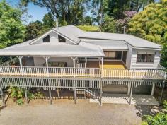  394 MOUNTAIN VIEW ROAD MALENY QLD 4552  $795,000 ucked privately away on an easy-care, one-acre parcel of land, this outstandingly presented home offers the perfect mix of classic character features with contemporary conveniences. Situated in the popular Mountain View Road area and only 3 kilometres east of Maleny, with walking and cycling paths to Mary Cairncross Park, nearby restaurants and into town, this property offers the ideal country lifestyle. The fully refurbished and freshly painted home provides our most sought-after criteria: - An expansive, open-plan living / dining / kitchen area with soaring ceiling - New Guinea Rosewood kitchen with quality appliances and stone benchtops - Most rooms flowing onto rambling, wrap-around verandahs - 3 spacious bedrooms, all with built-ins plus separate office / nursery room - 2 new and smartly appointed bathrooms - Artist studio / rumpus / home office and double lockup garage to lower level of house. Add to all this: a high level of privacy, the charming gardens, the stunning timber floors throughout and you have ticked all the most-popular boxes! 